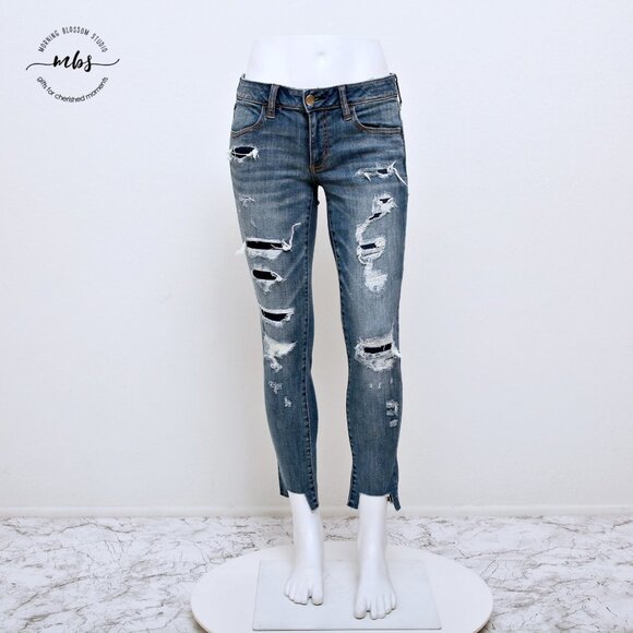 American Eagle Super Stretch Low Waist Distressed Raw Hem Jeggings - Picture 3 of 14